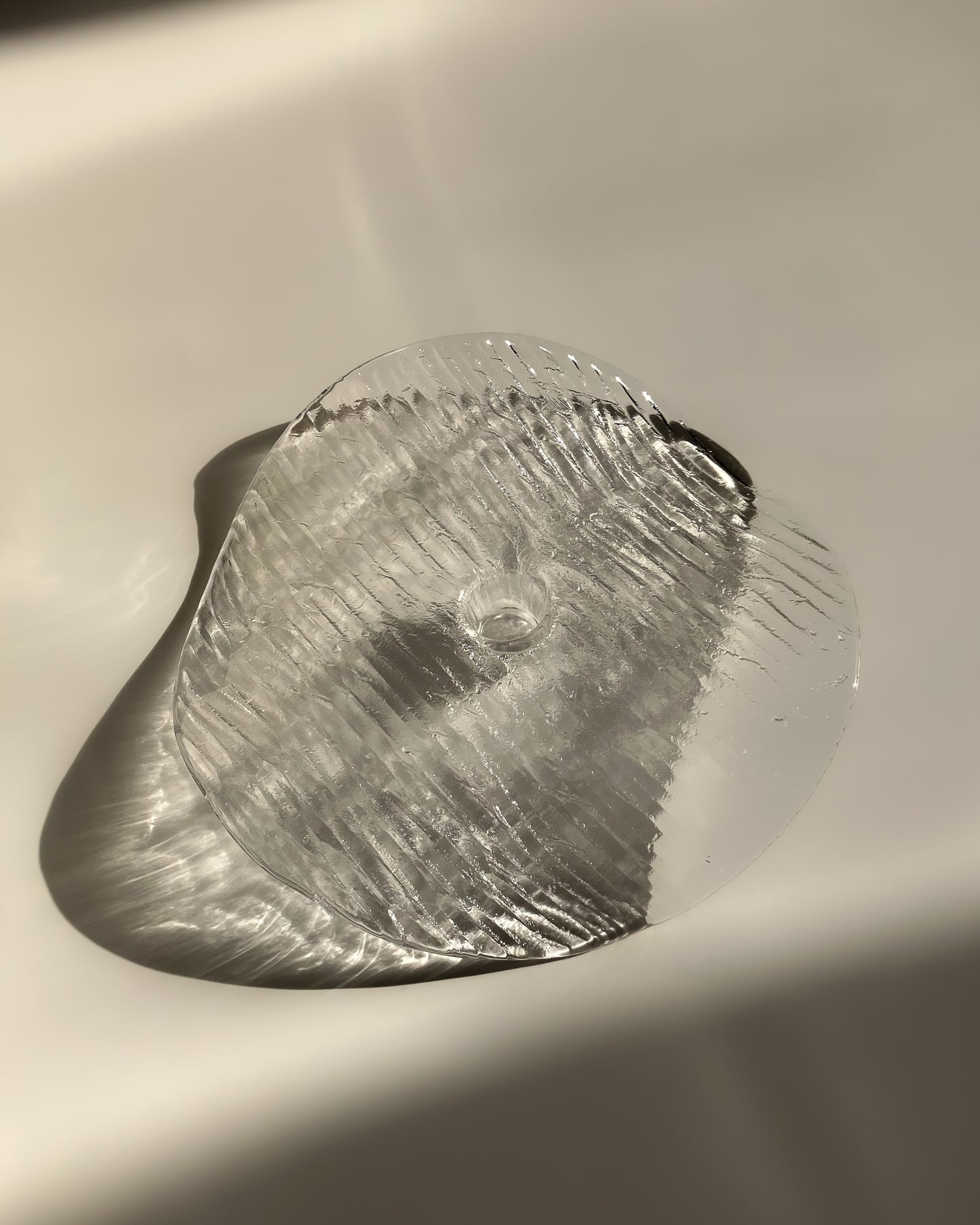 Plate-shaped glass candle holder