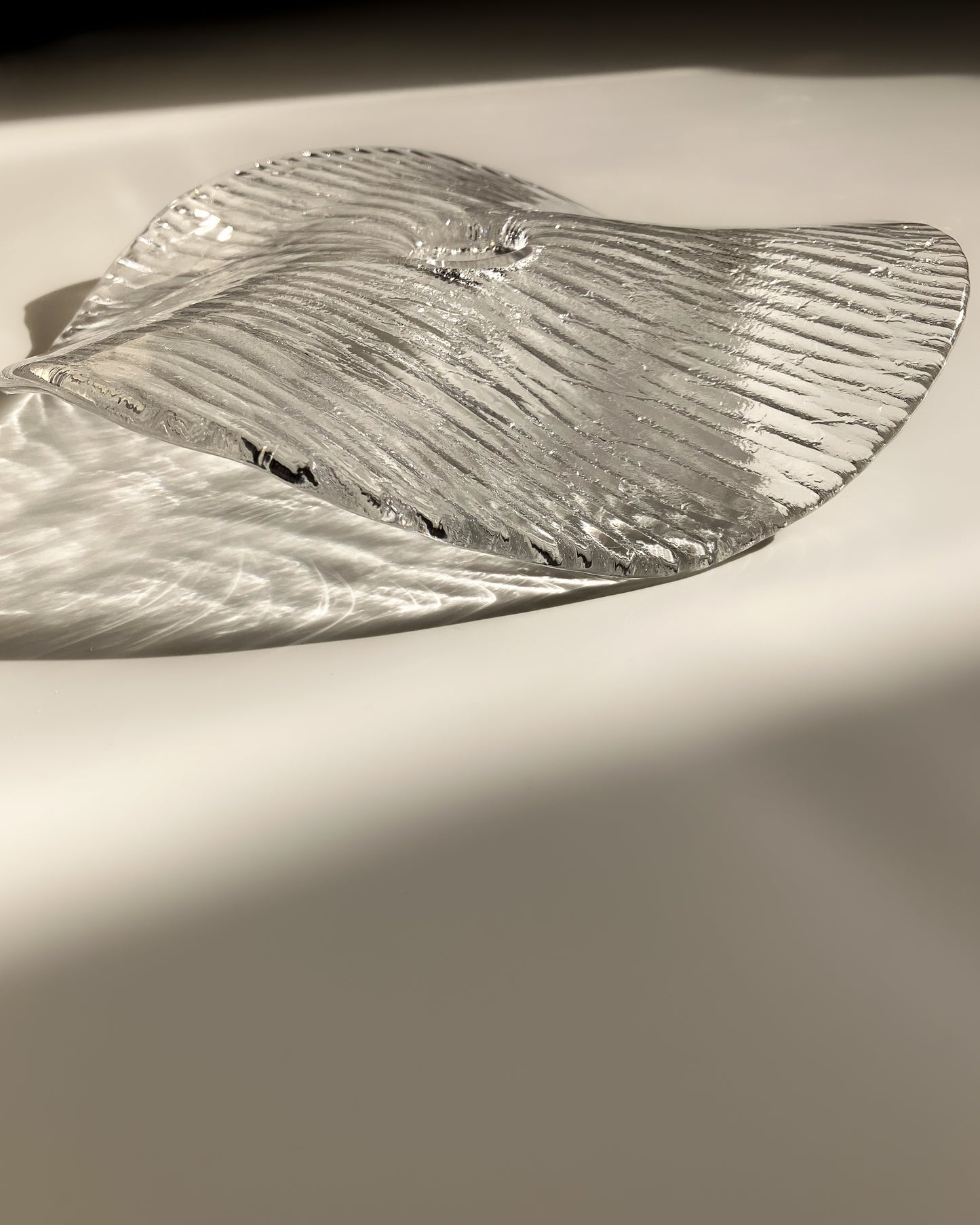 Plate-shaped glass candle holder