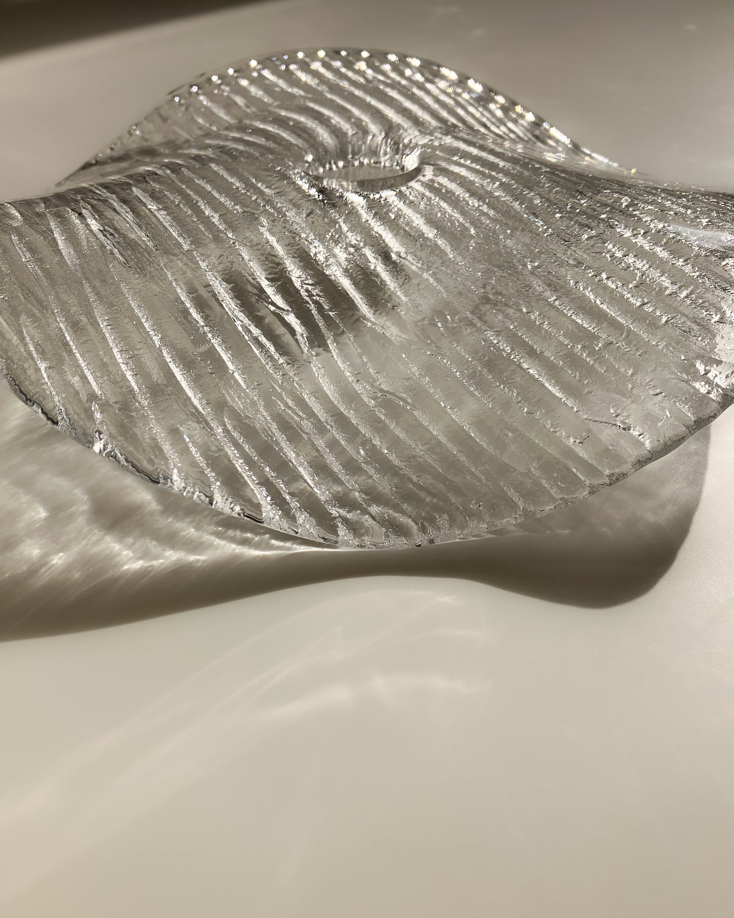 Plate-shaped glass candle holder