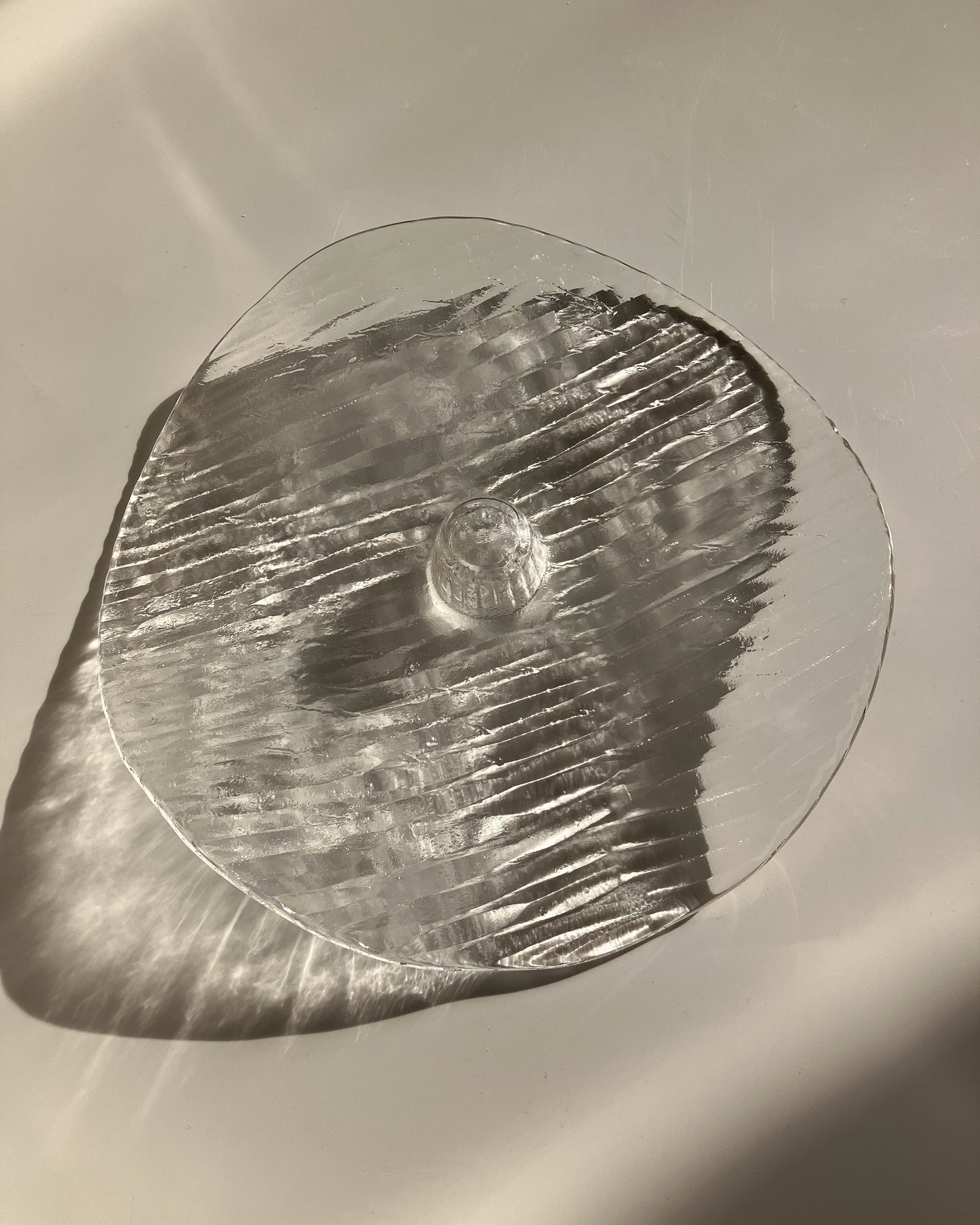 Plate-shaped glass candle holder