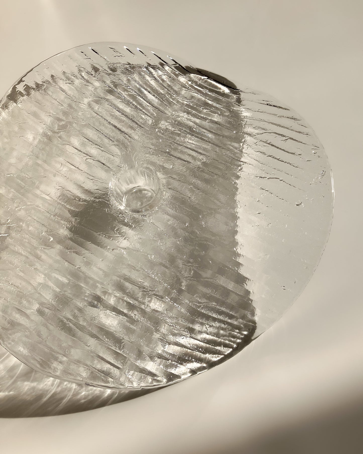 Plate-shaped glass candle holder