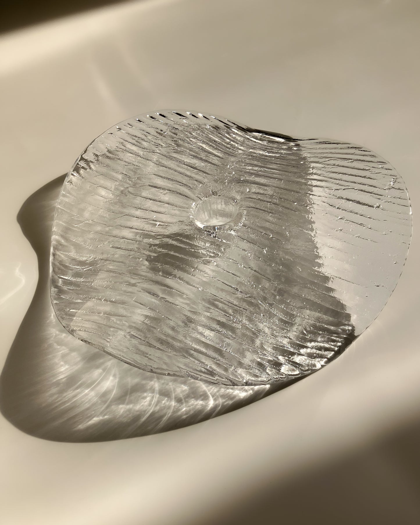 Plate-shaped glass candle holder